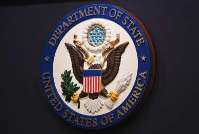 The State Department seal is seen on the briefing room lectern ahead of a briefing by State Department spokesperson Ned Price at the State Department in Washington, DC, on January 31, 2022. (Photo by MANDEL NGAN / POOL / AFP) (Photo by MANDEL NGAN/POOL/AFP via Getty Images)