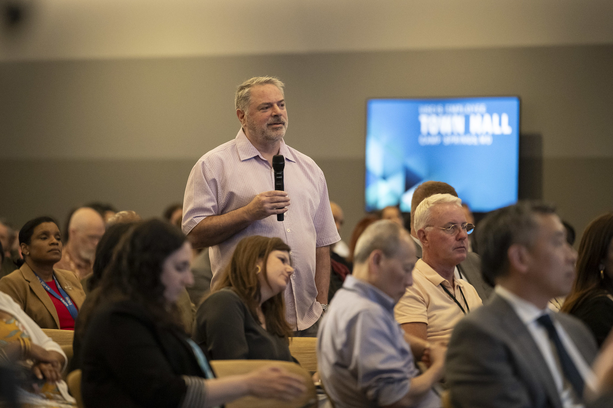 Image of employee at USCIS town hall meeting