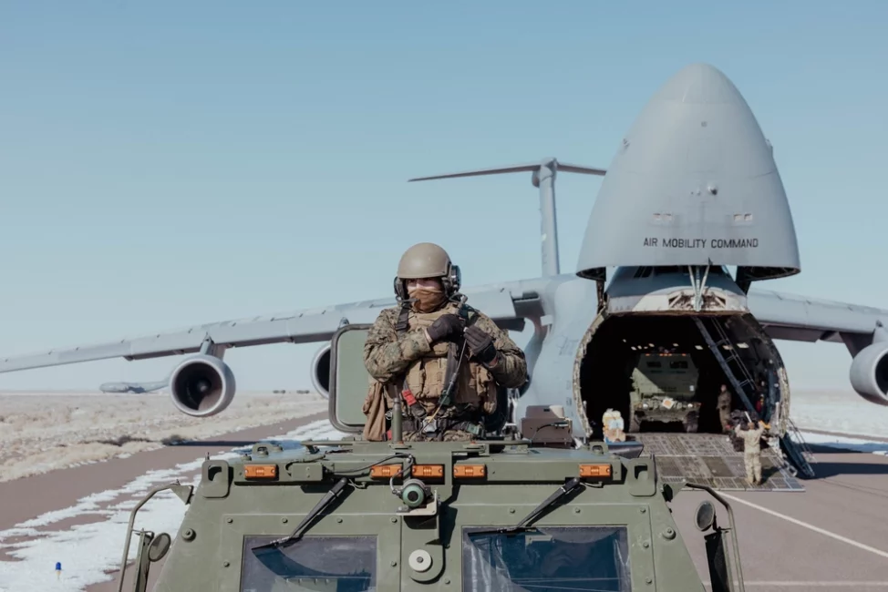 U.S. Marine Corps Sgt. Jesus Bustamante, a Houston, Texas, native and a high mobility artillery rocket system operator with 1st Battalion, 10th Marine Regiment, 2d Marine Division rides in a M142 High Mobility Artillery Rocket System during exercise Scarlet Dragon in Dugway, Utah, Feb. 2, 2023. Scarlet Dragon is a joint exercise in which the U.S. military branches test their interoperability capability with joint units. (U.S. Marine Corps photo by Lance Cpl. Emma Gray)