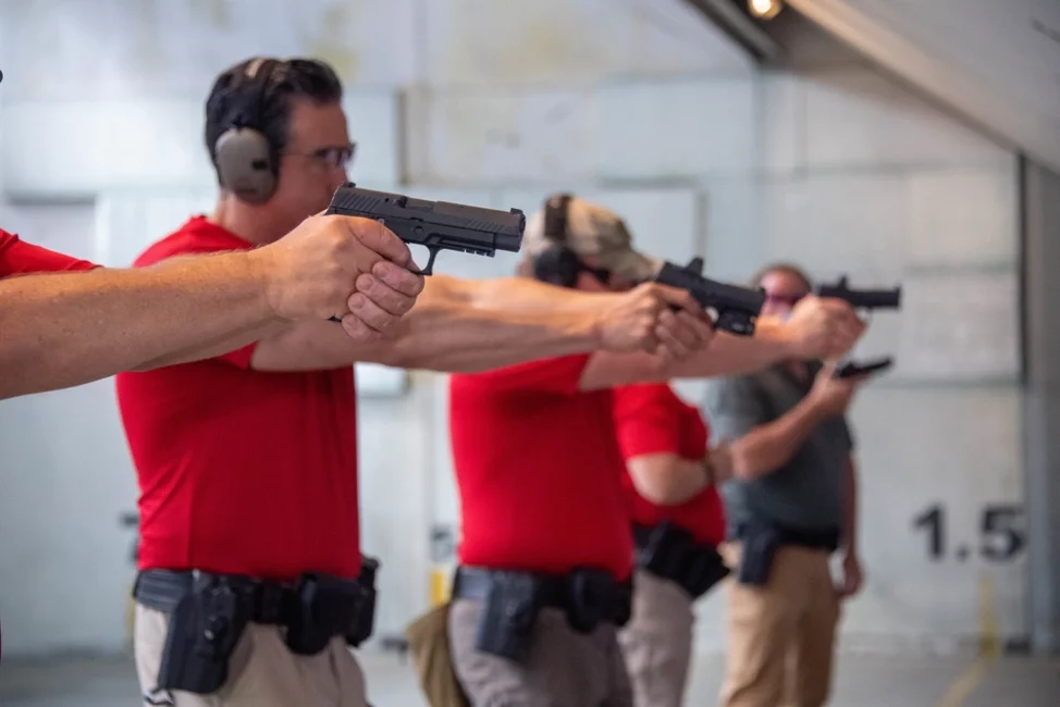 ICE Enforcement and Removal Operations (ERO) firearms instructors take aim at their targets during a training session at the Federal Law Enforcement Training Center (FLETC) in Glencoe, Georgia on April 12, 2022.