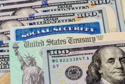 Social Security card, treasury check and 100 dollar bills. Concept of social security benefits payment, retirement and federal government benefits