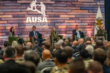 Danielle Moyer (left), executive director of the U.S. Army Contracting Command, speaks during a panel discussion to address accelerating the velocity of warfighter capabilities during the Association of the U.S. Army’s 2024 Annual Meeting and Exposition in Washington, D.C., Oct. 16, 2024. (U.S. Army photo by Bernardo Fuller) 