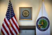 Flags decorate a space outside the office of the education secretary at the Education Department, Aug. 9, 2017, in Washington.