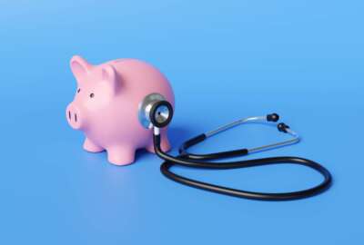 stethoscope on piggy bank