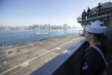 Sailors man the rails aboard the Nimitz-class aircraft carrier USS Abraham Lincoln (CVN 72). Abraham Lincoln, flagship of Carrier Strike Group (CSG) 3, returns to Naval Air Station North Island following deployment to the U.S. 3rd Fleet, U.S. 7th Fleet and U.S. 5th Fleet areas of operation. (U.S. Navy photo by Mass Communication Specialist 2nd Class Kassandra Alanis) 