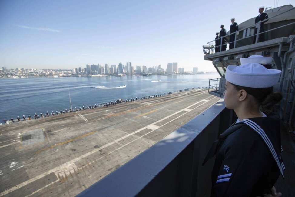 Sailors man the rails aboard the Nimitz-class aircraft carrier USS Abraham Lincoln (CVN 72). Abraham Lincoln, flagship of Carrier Strike Group (CSG) 3, returns to Naval Air Station North Island following deployment to the U.S. 3rd Fleet, U.S. 7th Fleet and U.S. 5th Fleet areas of operation. (U.S. Navy photo by Mass Communication Specialist 2nd Class Kassandra Alanis) 