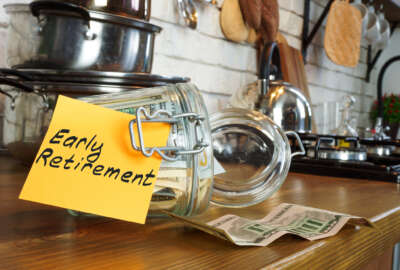 Glass jar with money on the home table