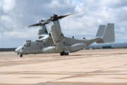 A military MV-22 Osprey preparing to takeoff on a cloudy day