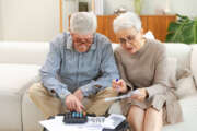 Senior couple managing home finances