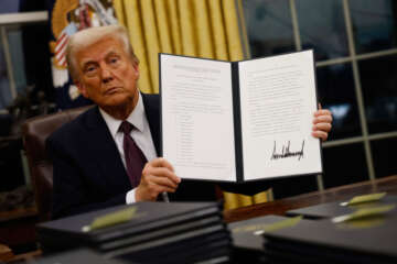 Donald Trump signs an executive order