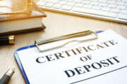 Certificate of deposit and pen on a desk