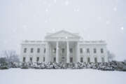 Snow falls on the White House