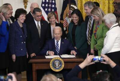 President Joe Biden signs the Social Security Fairness Act during a ceremony in the East Room of the White House, Sunday, Jan. 5, 2025, in Washington.